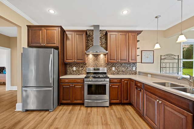 727 Sonny Boy Ln, Johns Island, SC 29455 - kitchen with appliances with stainless steel finishes, wall chimney exhaust hood, a sink, light wood-style floors, and crown molding
