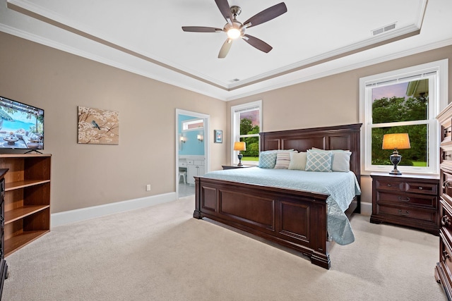727 Sonny Boy Ln, Johns Island, SC 29455 - bedroom featuring a tray ceiling, light carpet, crown molding, multiple windows, and baseboards