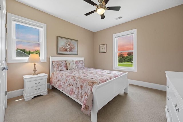 727 Sonny Boy Ln, Johns Island, SC 29455 - bedroom with light carpet, baseboards, and ceiling fan