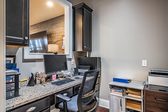 office area featuring built in desk and dark hardwood / wood-style floors