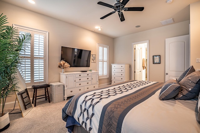 bedroom with light colored carpet and ceiling fan