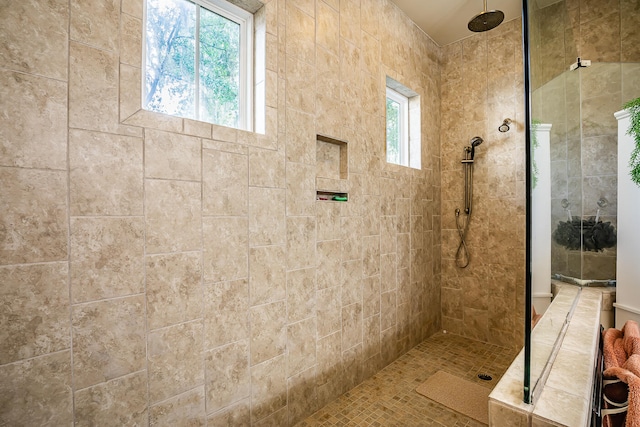 bathroom featuring a tile shower