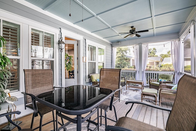 sunroom / solarium with ceiling fan