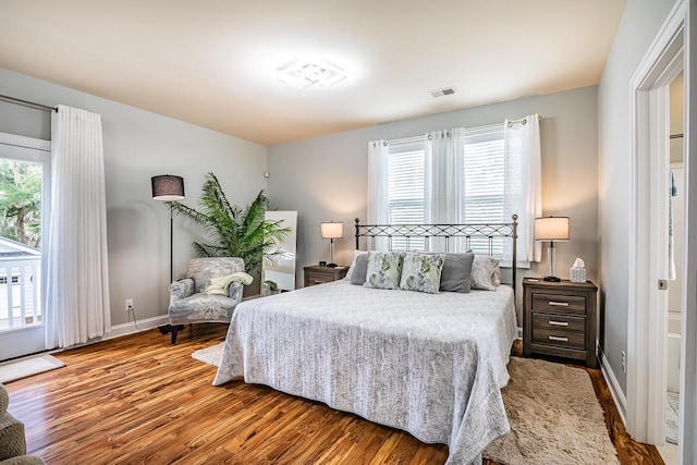 15 Carter Oaks, Ladys Island, SC 29907 - bedroom featuring wood finished floors, multiple windows, and baseboards