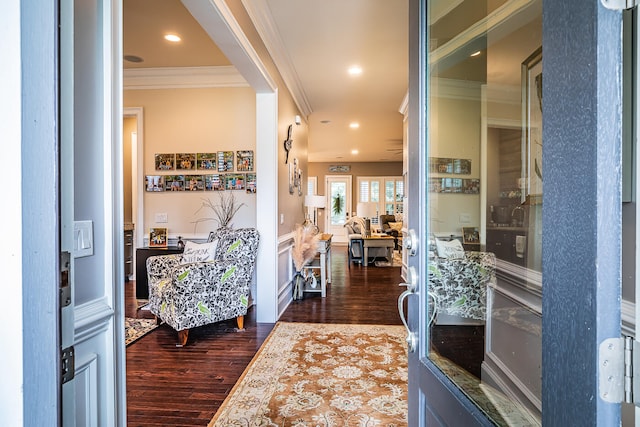 foyer with crown molding and dark hardwood / wood-style floors