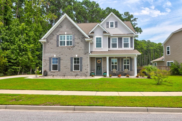 craftsman-style home with a porch and a front yard