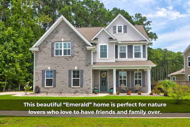 craftsman-style home featuring a porch and a front lawn