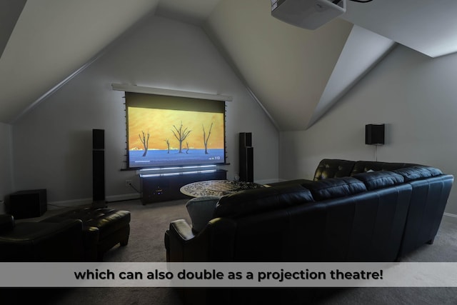 carpeted home theater with vaulted ceiling