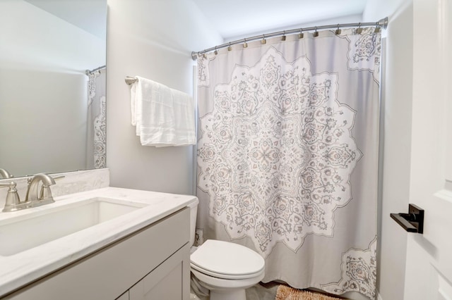 full bathroom featuring vanity, shower / tub combo with curtain, and toilet