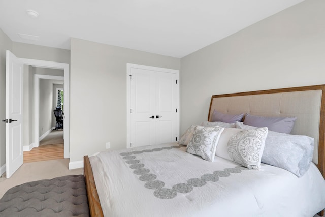 carpeted bedroom featuring a closet