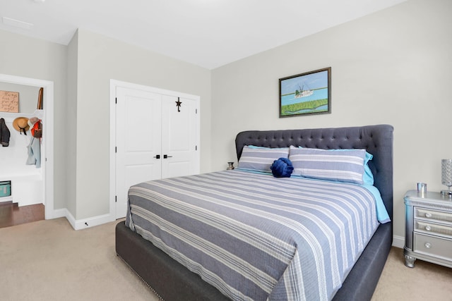 carpeted bedroom featuring a closet