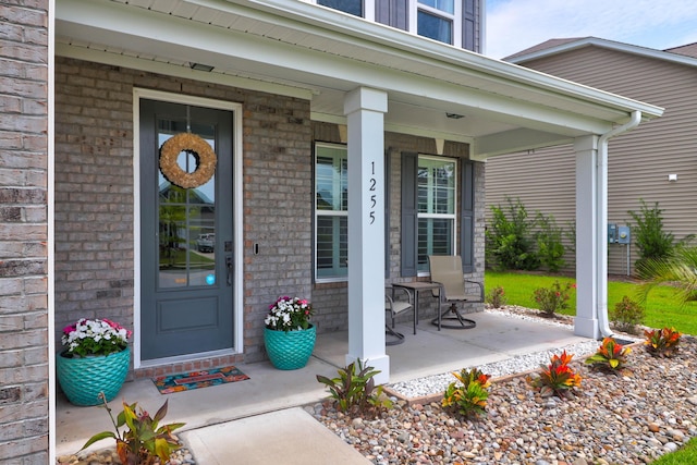 property entrance with covered porch