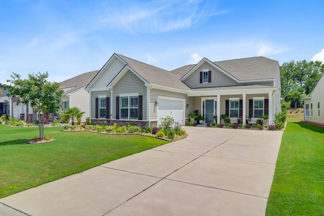 366 Tupelo Lake Dr, Summerville, SC 29486 - view of front of home with a garage, driveway, a front lawn, a porch, and stone siding