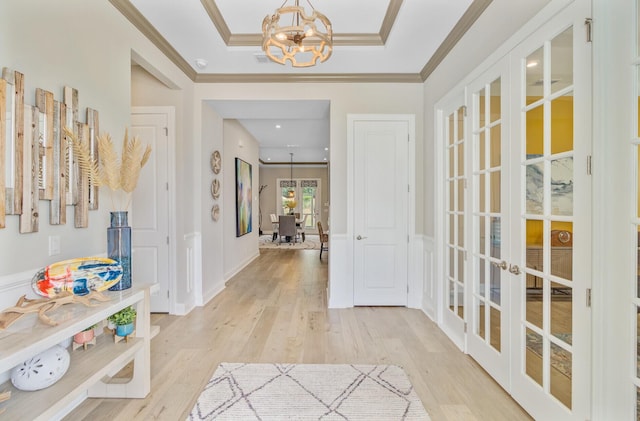 366 Tupelo Lake Dr, Summerville, SC 29486 - entrance foyer with french doors, a chandelier, light wood-type flooring, crown molding, and a raised ceiling