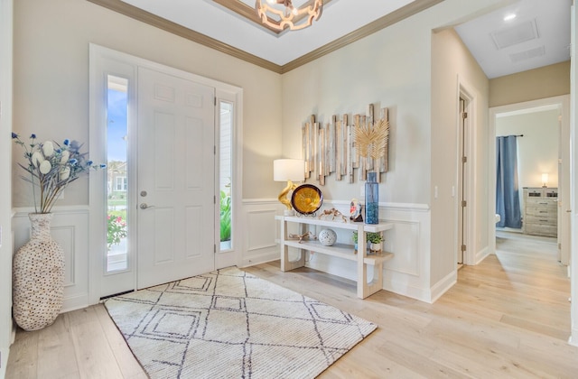 366 Tupelo Lake Dr, Summerville, SC 29486 - entrance foyer featuring wood finished floors, a decorative wall, a chandelier, and wainscoting