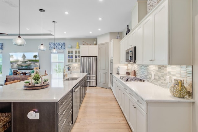 366 Tupelo Lake Dr, Summerville, SC 29486 - kitchen with a sink, appliances with stainless steel finishes, white cabinetry, recessed lighting, and backsplash