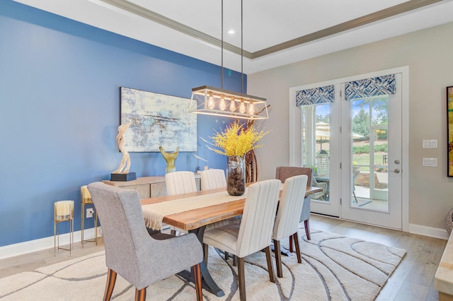 366 Tupelo Lake Dr, Summerville, SC 29486 - dining room featuring baseboards, wood finished floors, recessed lighting, a tray ceiling, and crown molding