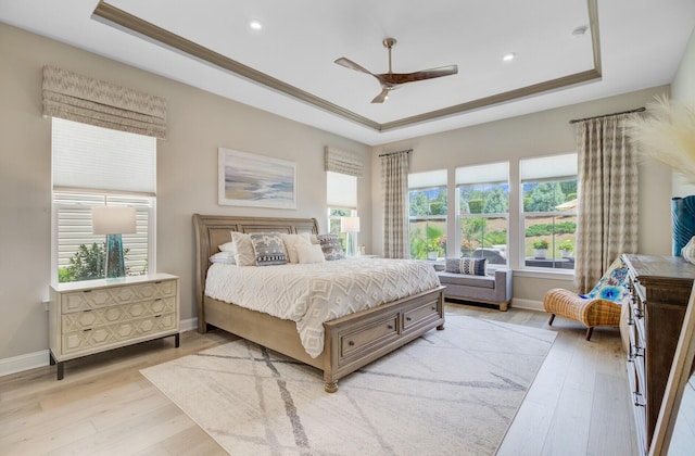 366 Tupelo Lake Dr, Summerville, SC 29486 - bedroom featuring a tray ceiling, light wood-type flooring, multiple windows, baseboards, and recessed lighting