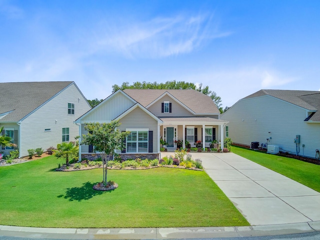 366 Tupelo Lake Dr, Summerville, SC 29486 - view of front of property featuring a porch, a front lawn, central AC unit, and concrete driveway