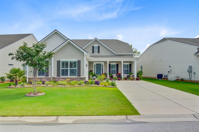 366 Tupelo Lake Dr, Summerville, SC 29486 - view of front of house with a porch, cooling unit, a front yard, and stone siding
