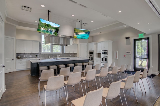 366 Tupelo Lake Dr, Summerville, SC 29486 - kitchen featuring decorative backsplash, a center island, white cabinets, recessed lighting, and dark wood-style floors