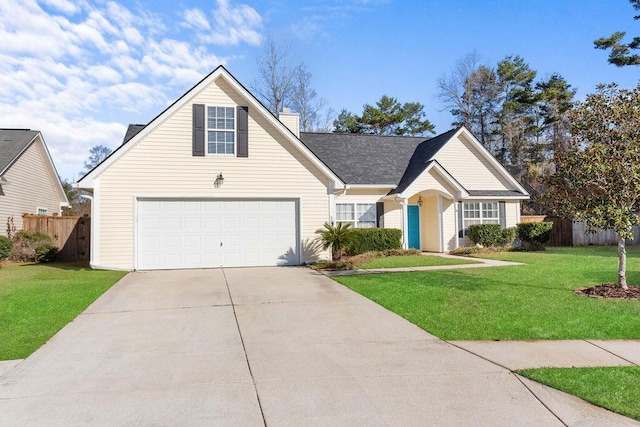 view of front of house featuring a garage and a front lawn