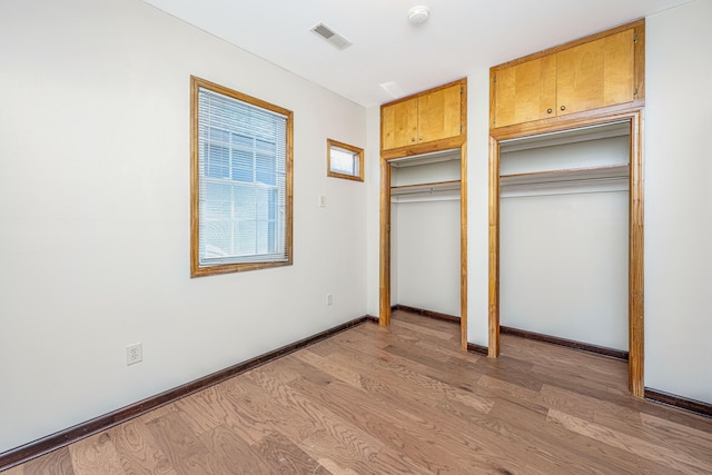 unfurnished bedroom with light hardwood / wood-style flooring