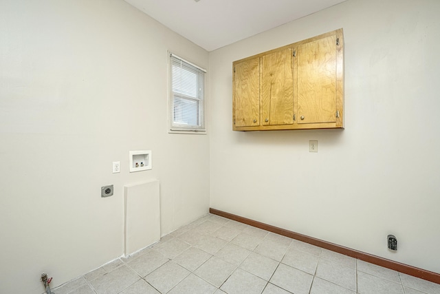 laundry area with cabinets, hookup for a washing machine, electric dryer hookup, and light tile patterned floors