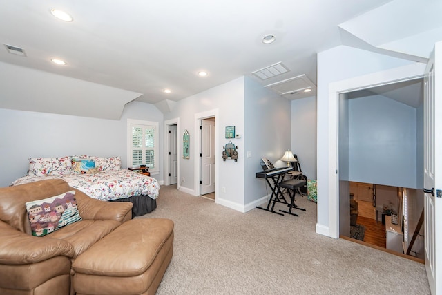 bedroom featuring light colored carpet and vaulted ceiling