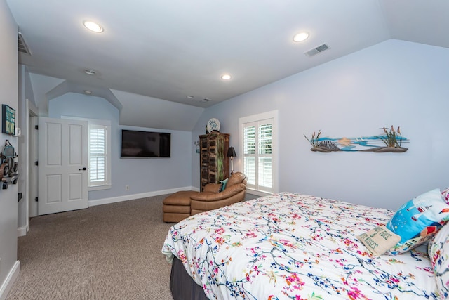 carpeted bedroom with vaulted ceiling