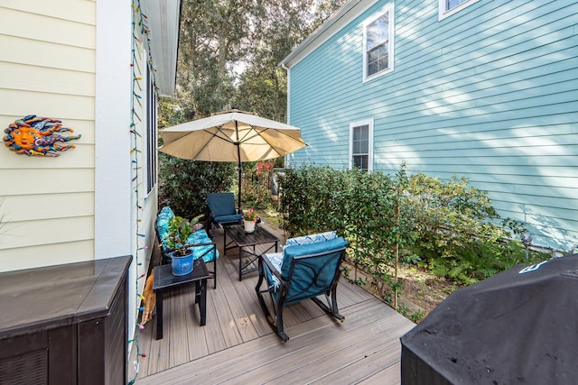 wooden deck featuring grilling area