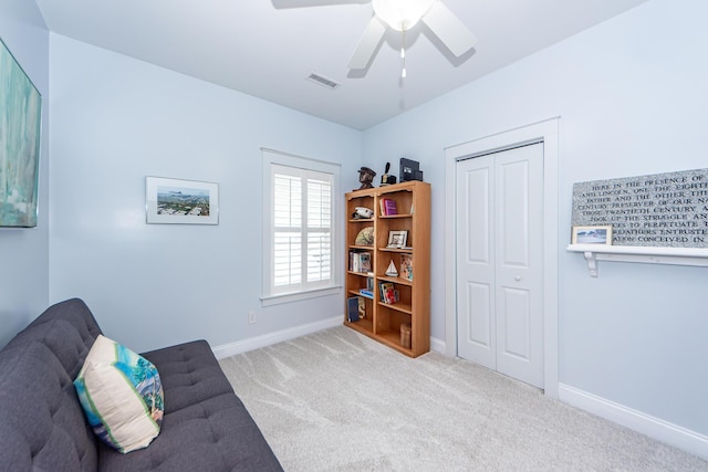 unfurnished room with light carpet and ceiling fan