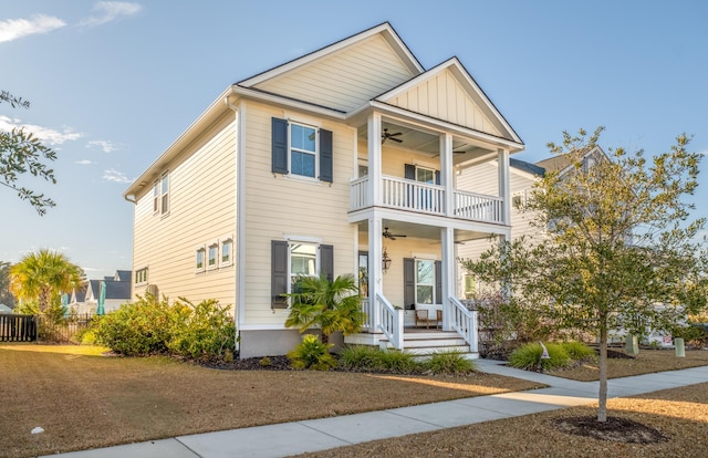 view of front of house with ceiling fan, a balcony, and covered porch