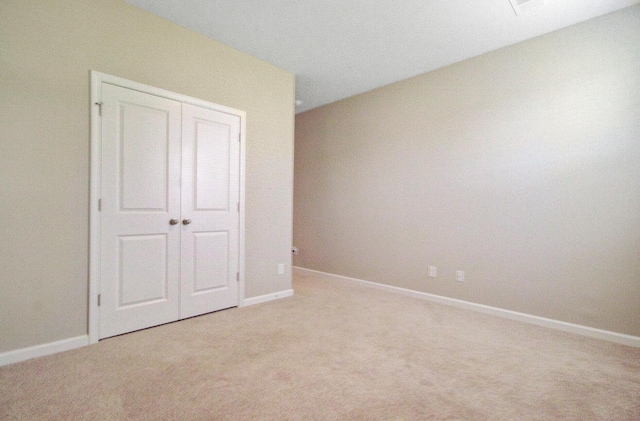 104 Wild Orchid Way, Huger, SC 29450 - unfurnished bedroom with light colored carpet and a closet