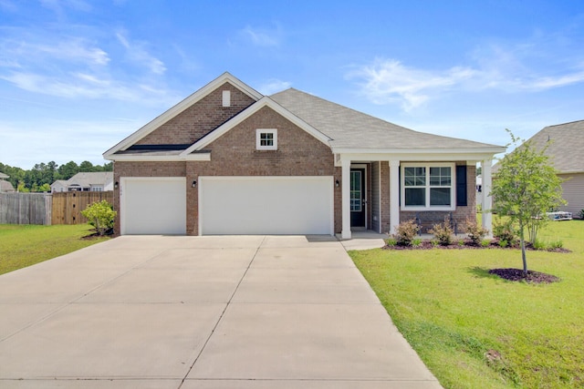 104 Wild Orchid Way, Huger, SC 29450 - view of front of property featuring brick siding, concrete driveway, an attached garage, and roof with shingles