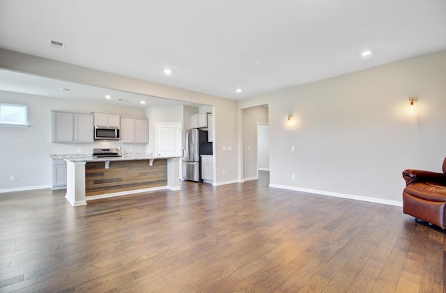 104 Wild Orchid Way, Huger, SC 29450 - living room with dark wood-style floors and recessed lighting