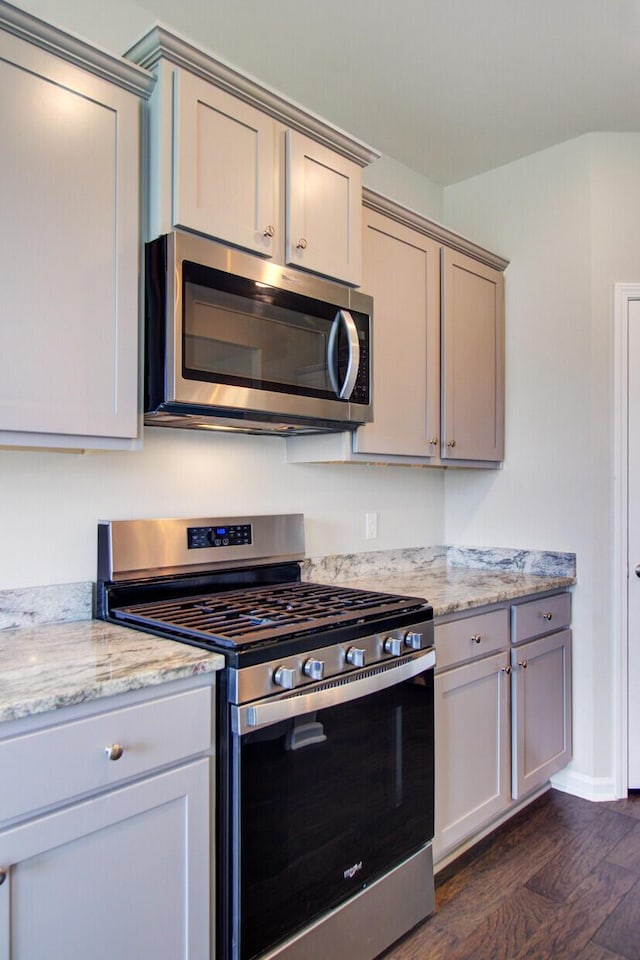 104 Wild Orchid Way, Huger, SC 29450 - kitchen with appliances with stainless steel finishes, dark wood-style flooring, and light stone countertops