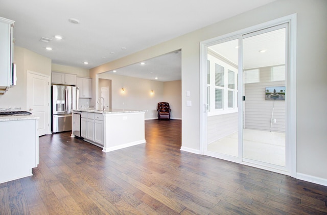 104 Wild Orchid Way, Huger, SC 29450 - kitchen with stainless steel appliances, dark wood-style flooring, light countertops, a center island with sink, and recessed lighting