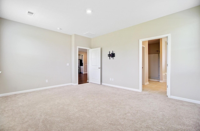104 Wild Orchid Way, Huger, SC 29450 - unfurnished bedroom featuring light carpet and ensuite bath