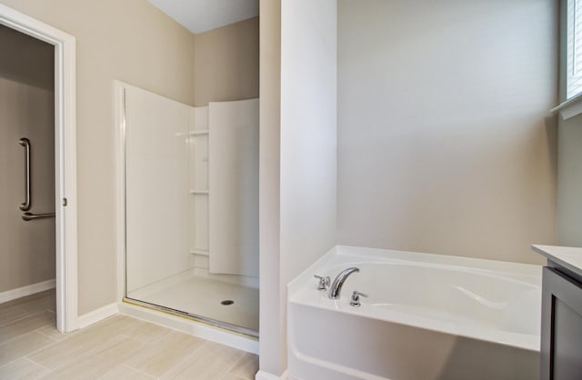 104 Wild Orchid Way, Huger, SC 29450 - full bath featuring a bath, a stall shower, and vanity