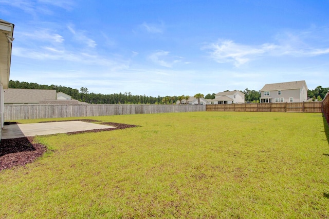 104 Wild Orchid Way, Huger, SC 29450 - fenced backyard featuring a patio area