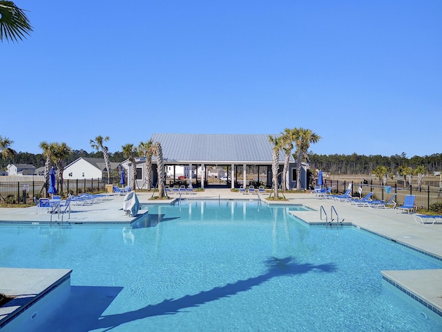 104 Wild Orchid Way, Huger, SC 29450 - community pool featuring a patio area