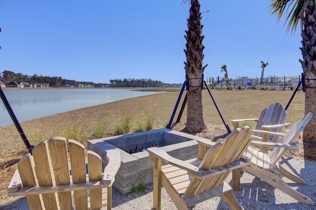 104 Wild Orchid Way, Huger, SC 29450 - view of patio featuring a fire pit and a water view