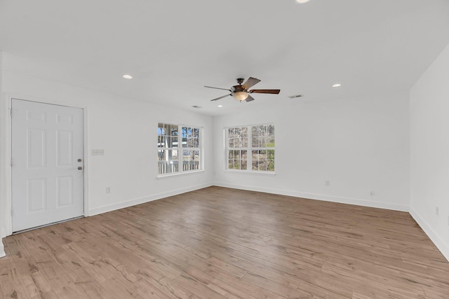 unfurnished living room with light wood finished floors, ceiling fan, baseboards, and recessed lighting