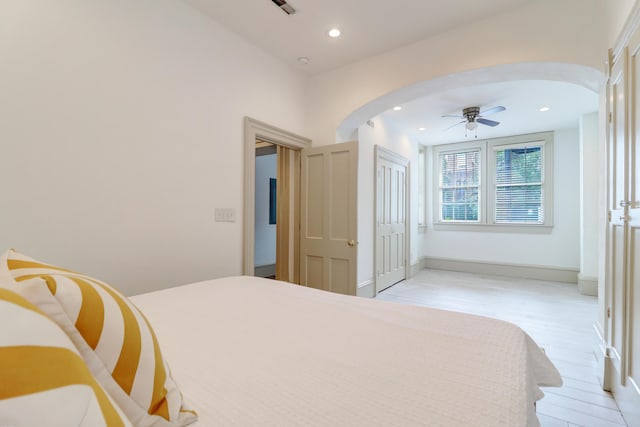 bedroom featuring light wood-type flooring and ceiling fan