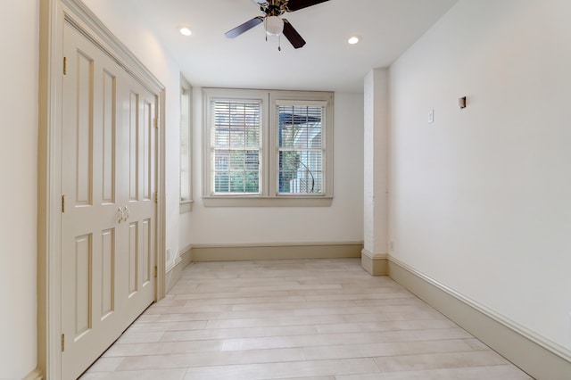 unfurnished bedroom with light wood-type flooring and ceiling fan