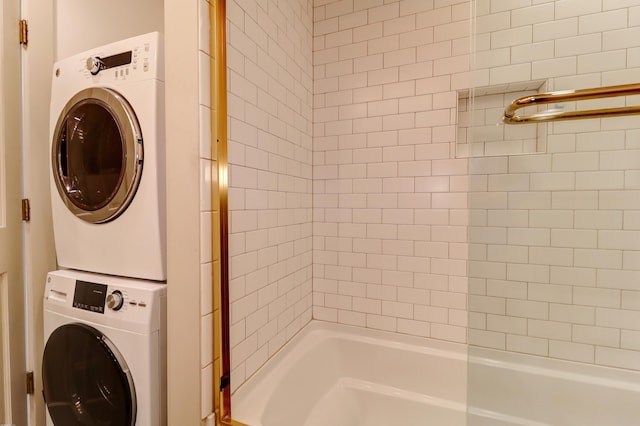 washroom with stacked washer / dryer