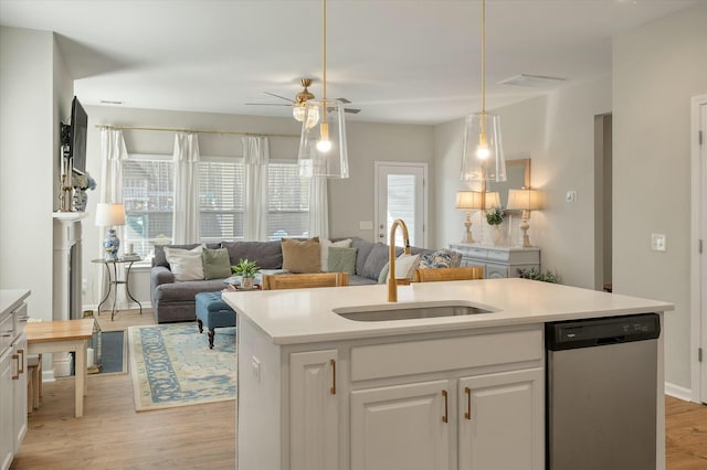 127 Surfbird Rd, Summerville, SC 29486 - kitchen featuring a sink, light wood-type flooring, dishwasher, open floor plan, and a ceiling fan