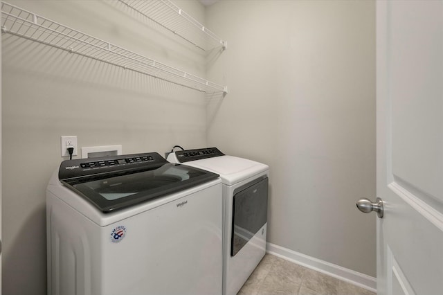 127 Surfbird Rd, Summerville, SC 29486 - laundry area with baseboards, laundry area, light tile patterned floors, and independent washer and dryer