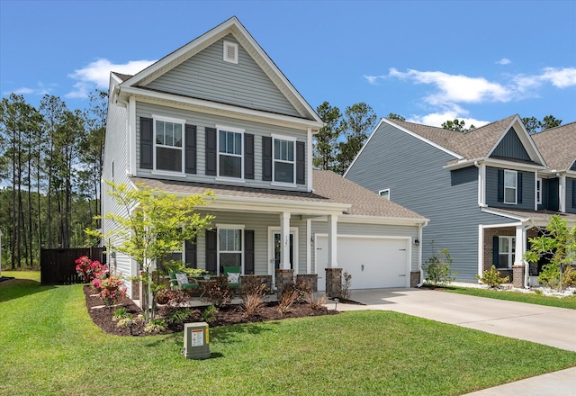 127 Surfbird Rd, Summerville, SC 29486 - view of front facade with covered porch, fence, an attached garage, driveway, and a front yard